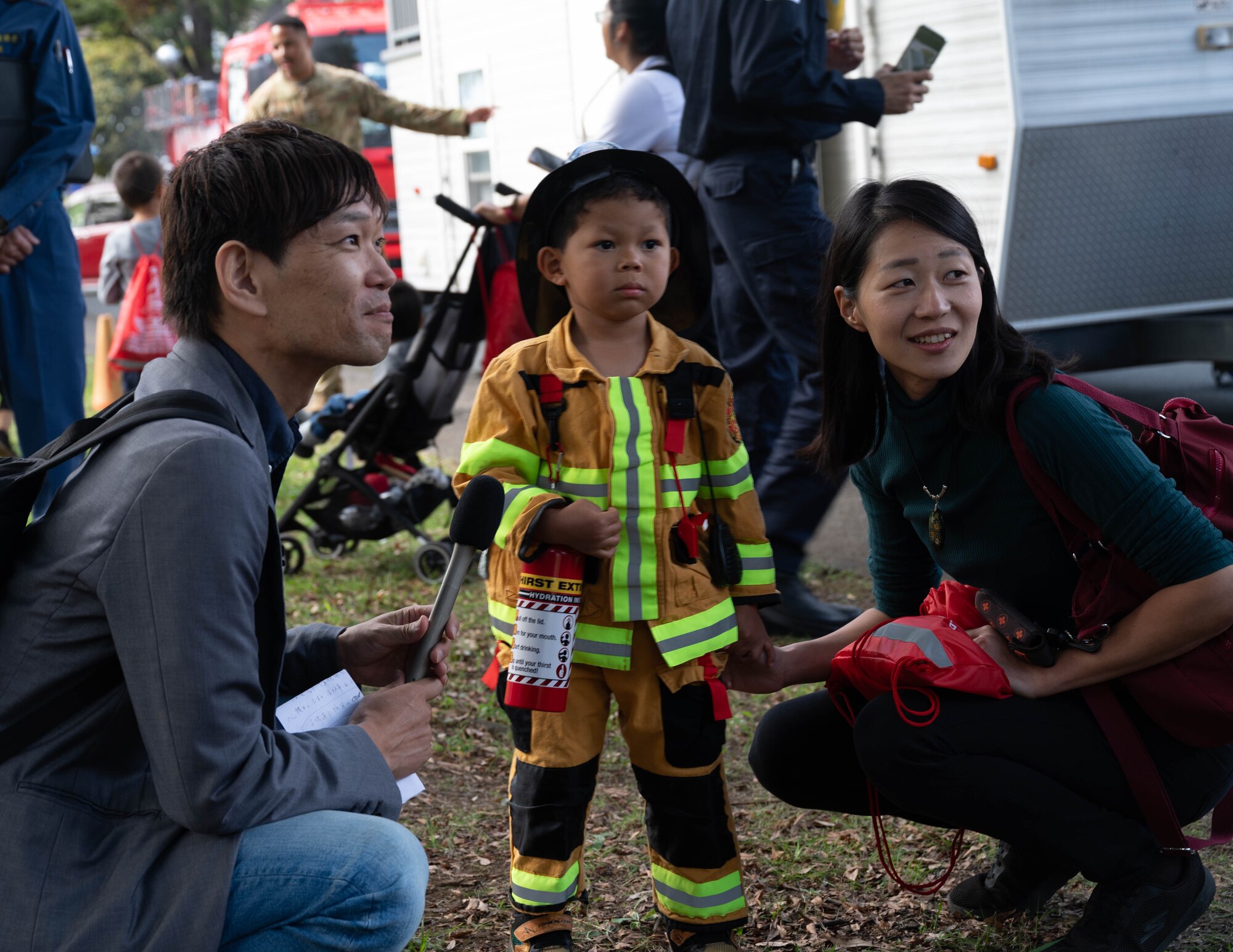 Community members prepare for a media interview.