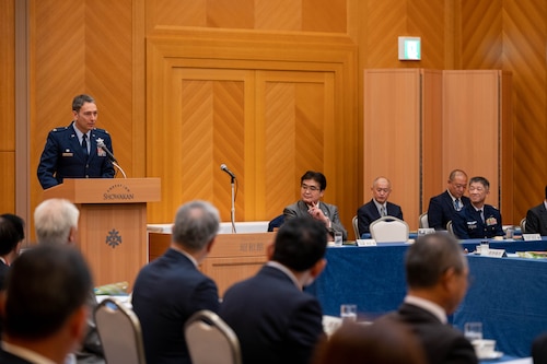 374th Airlift Wing Commander speaks during a conference