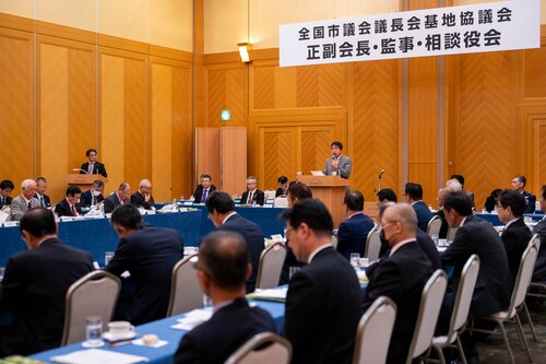 A Chairmen of Fussa City Assembly speaks during a conference