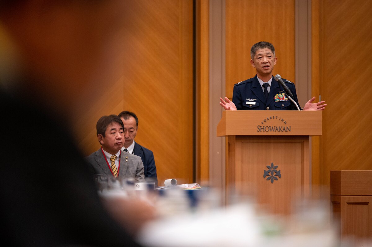 A Japan Air Self-Defense Force Operations Support Wing commander speaks during a conference