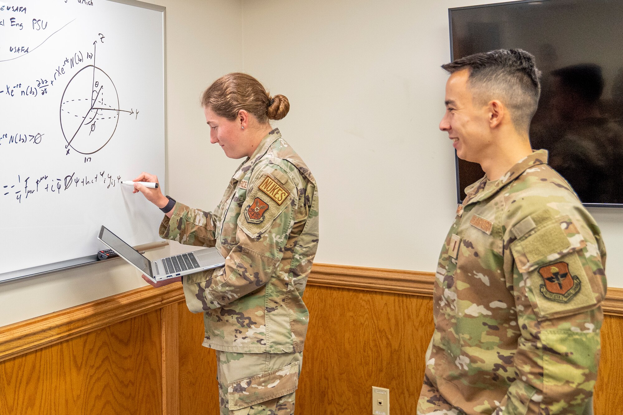 U.S. Air Force 2nd Lts. Emelia McLaughlin and Sean Richard, 335th Training Squadron operation analysis students, work on finding the value of functions at Allee Hall at Keesler Air Force Base, Mississippi, Oct. 10, 2023.