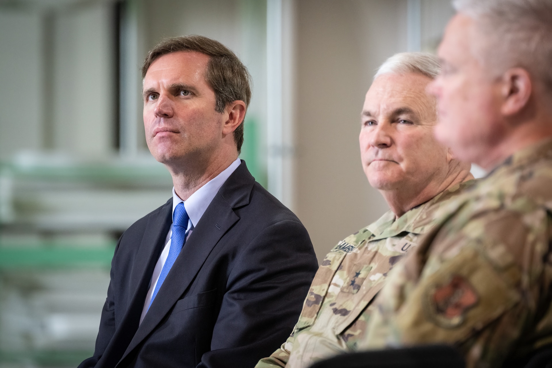 Kentucky Gov. Andy Beshear, left, attends an award ceremony at the Kentucky Air National Guard Base in Louisville, Ky., Oct. 14, 2023. The 123rd Airlift Wing received its 20th Air Force Outstanding Unit Award and a Meritorious Unit Award for superior achievement in a broad spectrum of missions around the world since 2019. (U.S. Air National Guard photo by Dale Greer)