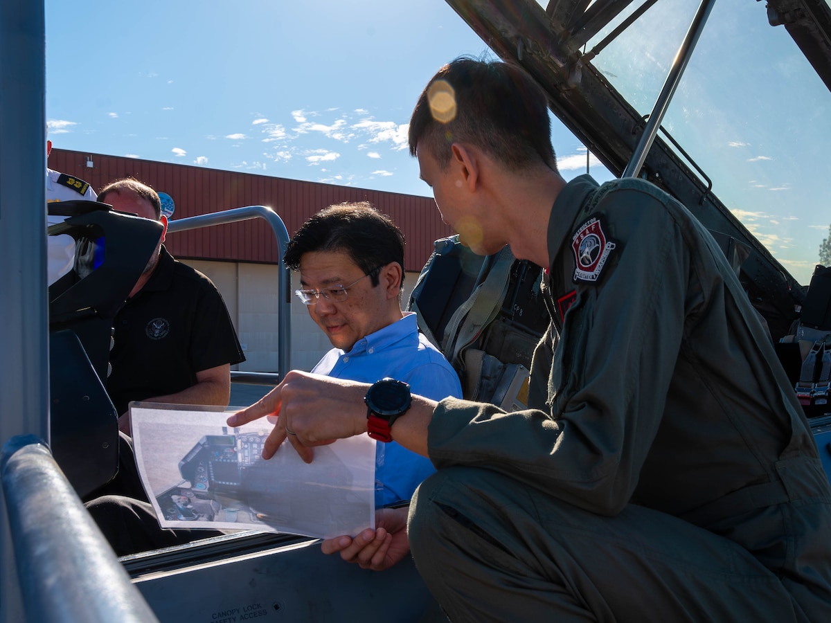 Lawrence Wong (left), Singapore Deputy Prime Minister and Minister of Finance, sits in a republic of Singapore F-16 Fighting Falcon Oct. 6, 2023, at Luke Air Force Base, Arizona.