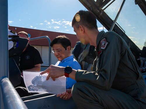 Lawrence Wong (left), Singapore Deputy Prime Minister and Minister of Finance, sits in a republic of Singapore F-16 Fighting Falcon Oct. 6, 2023, at Luke Air Force Base, Arizona.