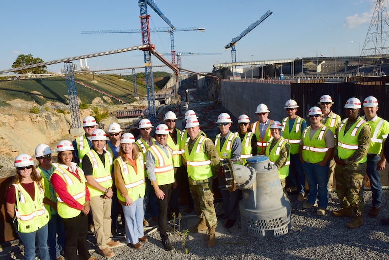 Secretary of the Army for Civil Works Michael L. Connors poses with Lt. Col. Robert W. Green, U.S. Army Corps of Engineers Nashville District commander, and employees Oct. 12, 2023, while overlooking the Kentucky Lock Addition Project on the Tennessee River in Grand Rivers, Kentucky. (USACE Photo by Lee Roberts)
