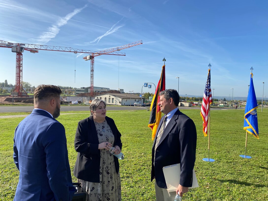 U.S. Army Corps of Engineers, Europe District Project Manager Todd Bishop, incoming Spangdahlem Elementary School Principal Monika Kerner and Europe District Program Manager Steve Ross discuss progress on construction of the new Spangdahlem Elementary School visible behind them on Spangdahlem Air Base October 11, 2023. They were there with representative from the Department of Defense Education Activity, 52nd Fighter Wing, U.S. Army Corps of Engineers, German construction partners and other members of the Spangdahlem Air Base community to celebrate the project with ceremonial groundbreaking. (U.S. Army photo by Chris Gardner)