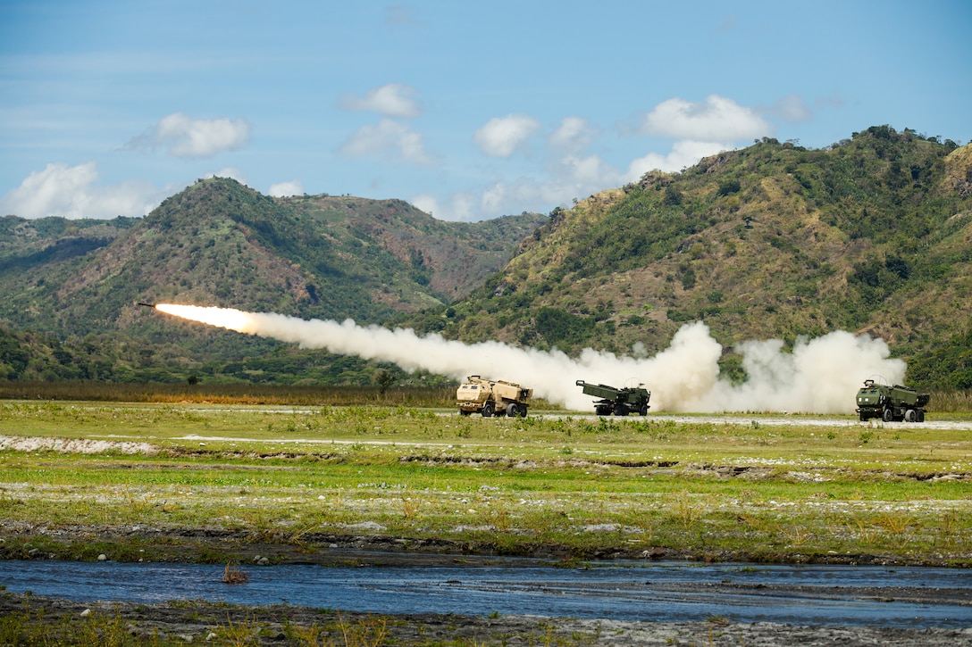 U.S. Army and Marine Corps High Mobility Artillery Rocket Systems assigned to 1st Battalion, 94th Field Artillery Regiment, and 3d Battalion, 12th Marines, 3d Marine Division conduct the combined arms live-fire exercise during Balikatan 22 at Colonel Ernesto Ravina Air Base, Tarlac, Philippines, March 31, 2022. Balikatan is an annual exercise between the Armed Forces of the Philippines and U.S. military designed to strengthen bilateral interoperability, capabilities, trust, and cooperation built over decades shared experiences. Balikatan, Tagalog for ‘shoulder-to-shoulder,’ is a long-standing bilateral exercise between the Philippines and the United States highlighting the deep-rooted partnership between both countries. BK22 is the 37th iteration of the exercise and coincides with the 75th anniversary of U.S.-Philippine security cooperation.