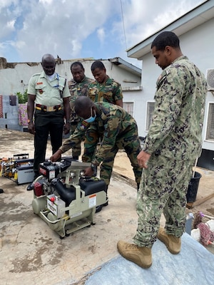 Engineman 1st Class Benfry Dejesus oversees equipment start up training of an ultra-low volume truck mounted sprayer during an Operational Pest Management Equipment Training (OPMET) in Accra, Ghana, July 13, 2023. The training exercise introduced GAF members to skills needed to conduct pest management surveillance as well as proper use, maintenance, troubleshooting, and field repair of pesticide application equipment for operational military forces. (U.S. Navy photo by Lt. j.g. John So)