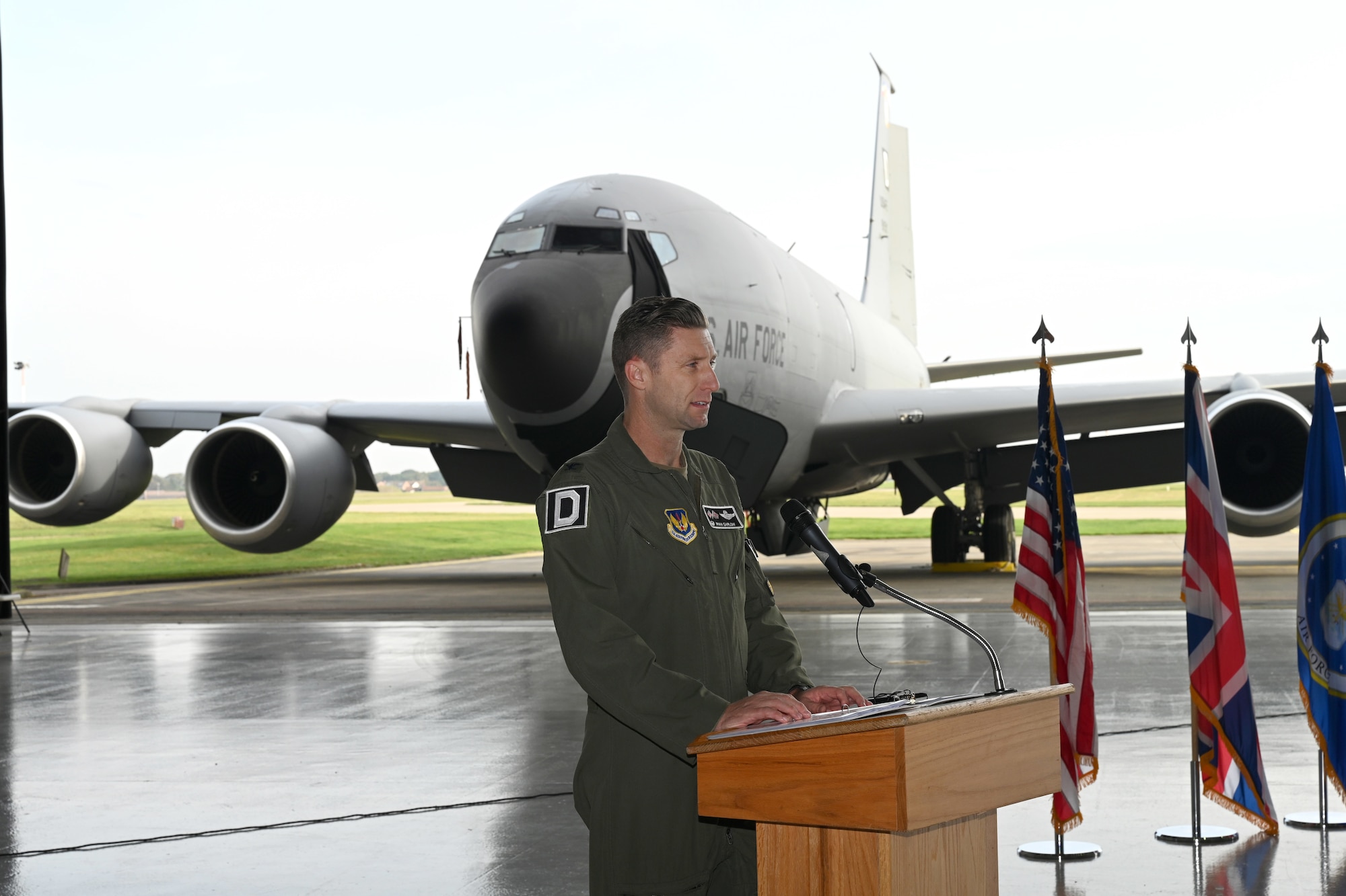 U.S. Air Force Col. Ryan Garlow, 100th Air Refueling Wing commander, shares some of the history of what became known as “Black Week” for the 100th Bomb Group during World War II, and the heritage of “Squawkin Hawk,” originally a B-17 Flying Fortress, now a nose art on a KC-135 Stratotanker during a nose art dedication ceremony at Royal Air Force Mildenhall, England, Oct. 10, 2023. Garlow also has a personal tie to the 100th Bomb Group as his step-grandfather, Tech. Sgt. James P. Scott Jr., was part of the crew on the B-17 “High Life,” also stationed at Thorpe Abbotts during World War II. (U.S. Air Force photo by Karen Abeyasekere)