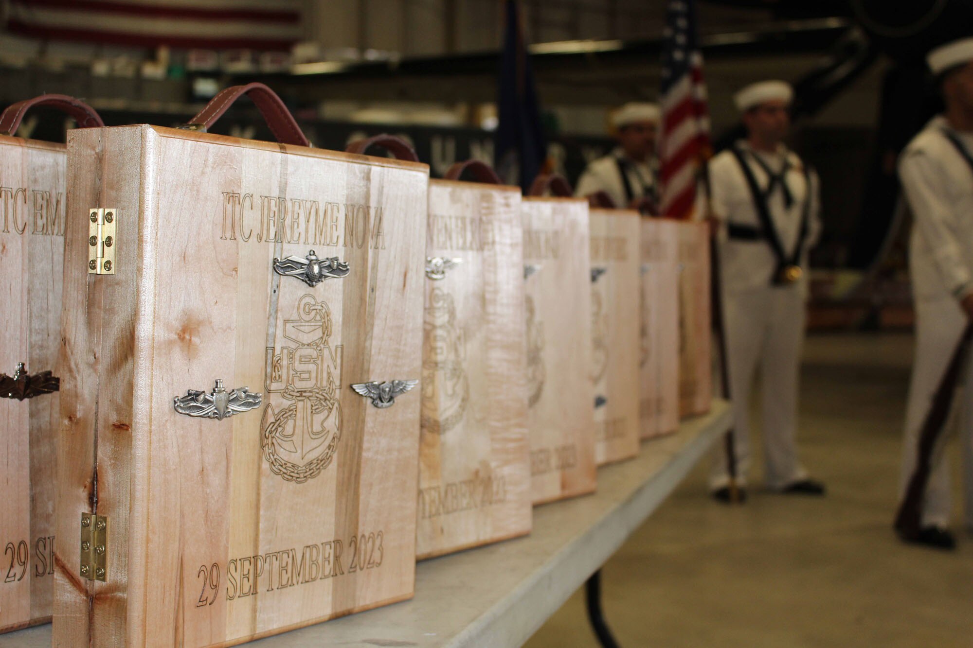 NIWC Atlantic joined forces with the Airborne Command & Control and Logistics Wing (ACCLOGWING) for the 2023 Navy Chief Petty Officer Pinning ceremony hosted by VAW-120 on Sept. 29 at 10:00am in LP-34 Hangar, Norfolk, VA. NIWC Atlantic's YNC Bilaal Porter, ITC Nick Mayer, LSC Matthew Hughes, ITC Jereyme Nova, and OSC Tonya Booker, along with 20 other ACCLOGWING CPO Selectees had their anchors pinned on and their caps donned during the traditional Navy ceremony.  NIWC Atlantic's GySgt Regino Rosales (USMC) also completed the precursor CPO season training and was recognized as an Honorary Navy Chief Petty Officer.