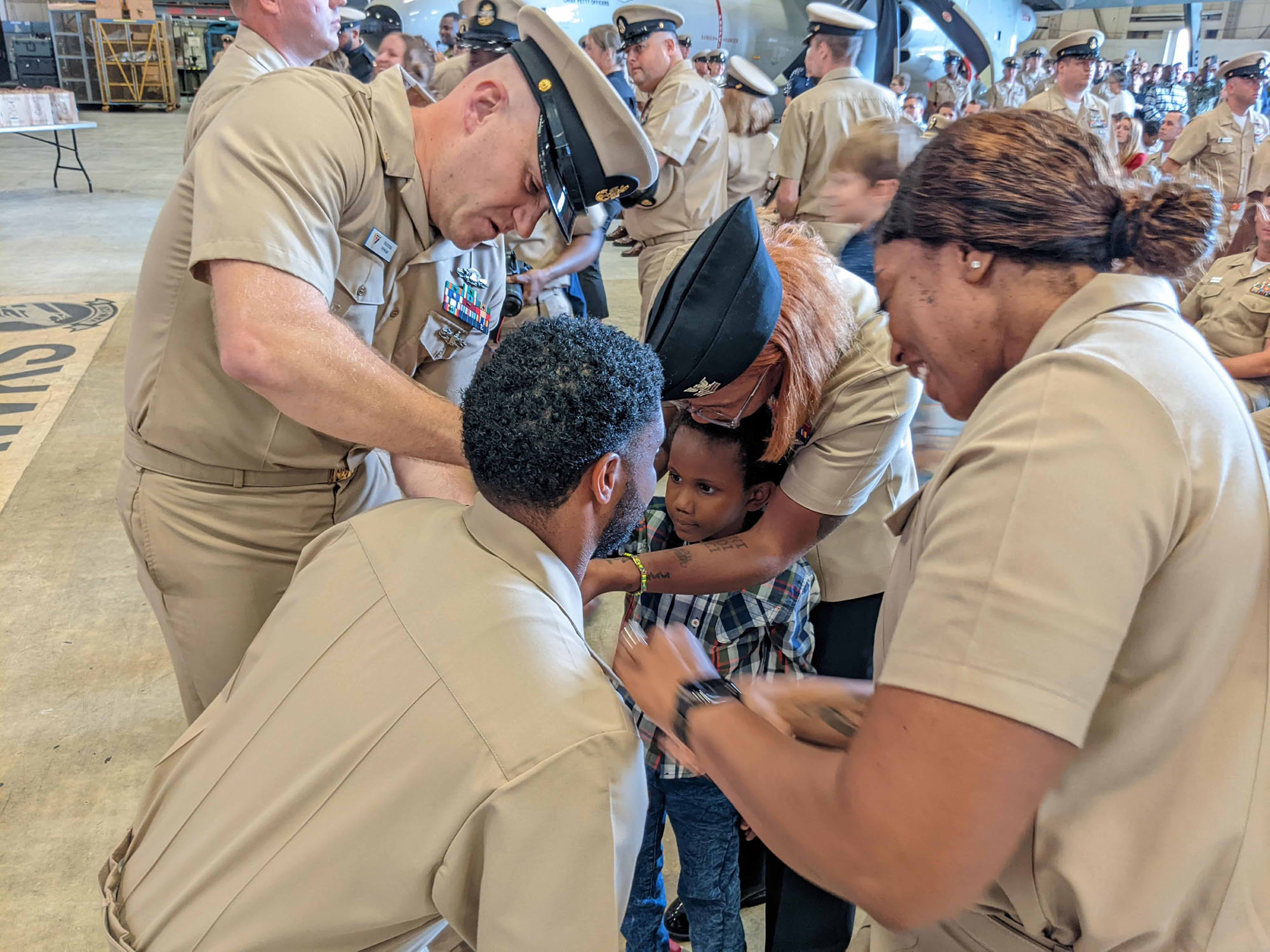 NIWC Atlantic joined forces with the Airborne Command & Control and Logistics Wing (ACCLOGWING) for the 2023 Navy Chief Petty Officer Pinning ceremony hosted by VAW-120 on Sept. 29 at 10:00am in LP-34 Hangar, Norfolk, VA. NIWC Atlantic's YNC Bilaal Porter, ITC Nick Mayer, LSC Matthew Hughes, ITC Jereyme Nova, and OSC Tonya Booker, along with 20 other ACCLOGWING CPO Selectees had their anchors pinned on and their caps donned during the traditional Navy ceremony.  NIWC Atlantic's GySgt Regino Rosales (USMC) also completed the precursor CPO season training and was recognized as an Honorary Navy Chief Petty Officer.