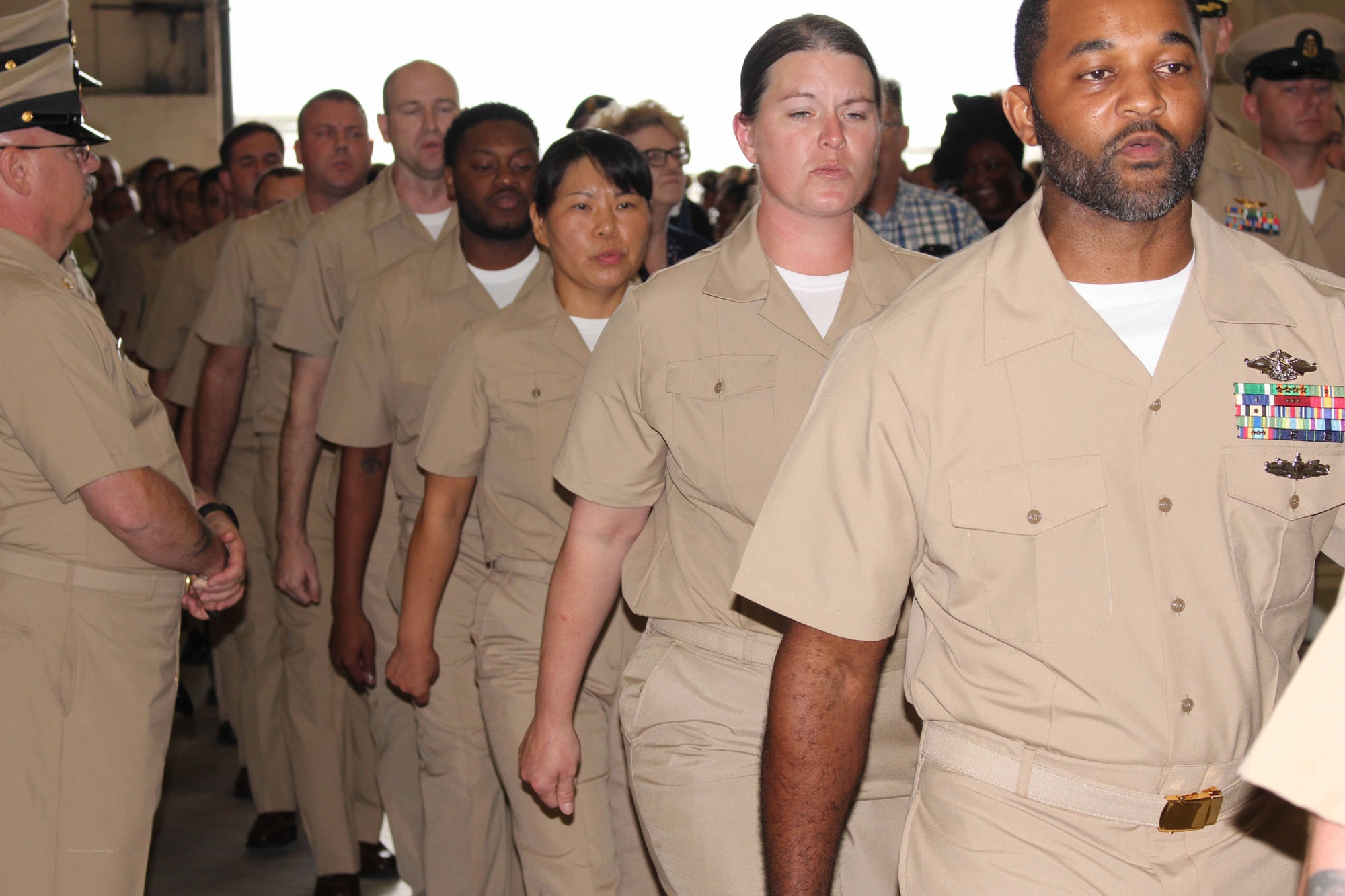 NIWC Atlantic joined forces with the Airborne Command & Control and Logistics Wing (ACCLOGWING) for the 2023 Navy Chief Petty Officer Pinning ceremony hosted by VAW-120 on Sept. 29 at 10:00am in LP-34 Hangar, Norfolk, VA. NIWC Atlantic's YNC Bilaal Porter, ITC Nick Mayer, LSC Matthew Hughes, ITC Jereyme Nova, and OSC Tonya Booker, along with 20 other ACCLOGWING CPO Selectees had their anchors pinned on and their caps donned during the traditional Navy ceremony.  NIWC Atlantic's GySgt Regino Rosales (USMC) also completed the precursor CPO season training and was recognized as an Honorary Navy Chief Petty Officer.