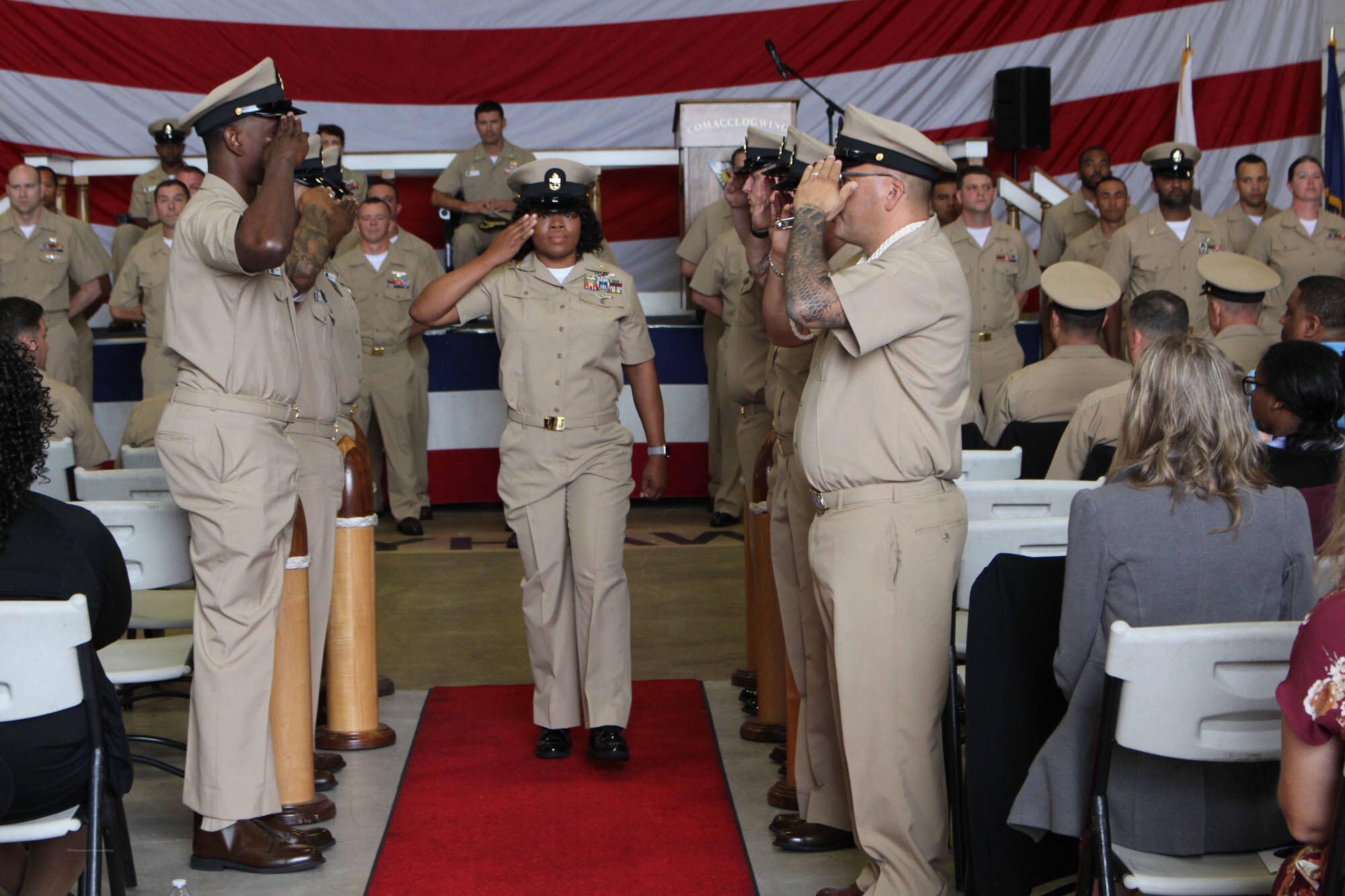 NIWC Atlantic joined forces with the Airborne Command & Control and Logistics Wing (ACCLOGWING) for the 2023 Navy Chief Petty Officer Pinning ceremony hosted by VAW-120 on Sept. 29 at 10:00am in LP-34 Hangar, Norfolk, VA. NIWC Atlantic's YNC Bilaal Porter, ITC Nick Mayer, LSC Matthew Hughes, ITC Jereyme Nova, and OSC Tonya Booker, along with 20 other ACCLOGWING CPO Selectees had their anchors pinned on and their caps donned during the traditional Navy ceremony.  NIWC Atlantic's GySgt Regino Rosales (USMC) also completed the precursor CPO season training and was recognized as an Honorary Navy Chief Petty Officer.