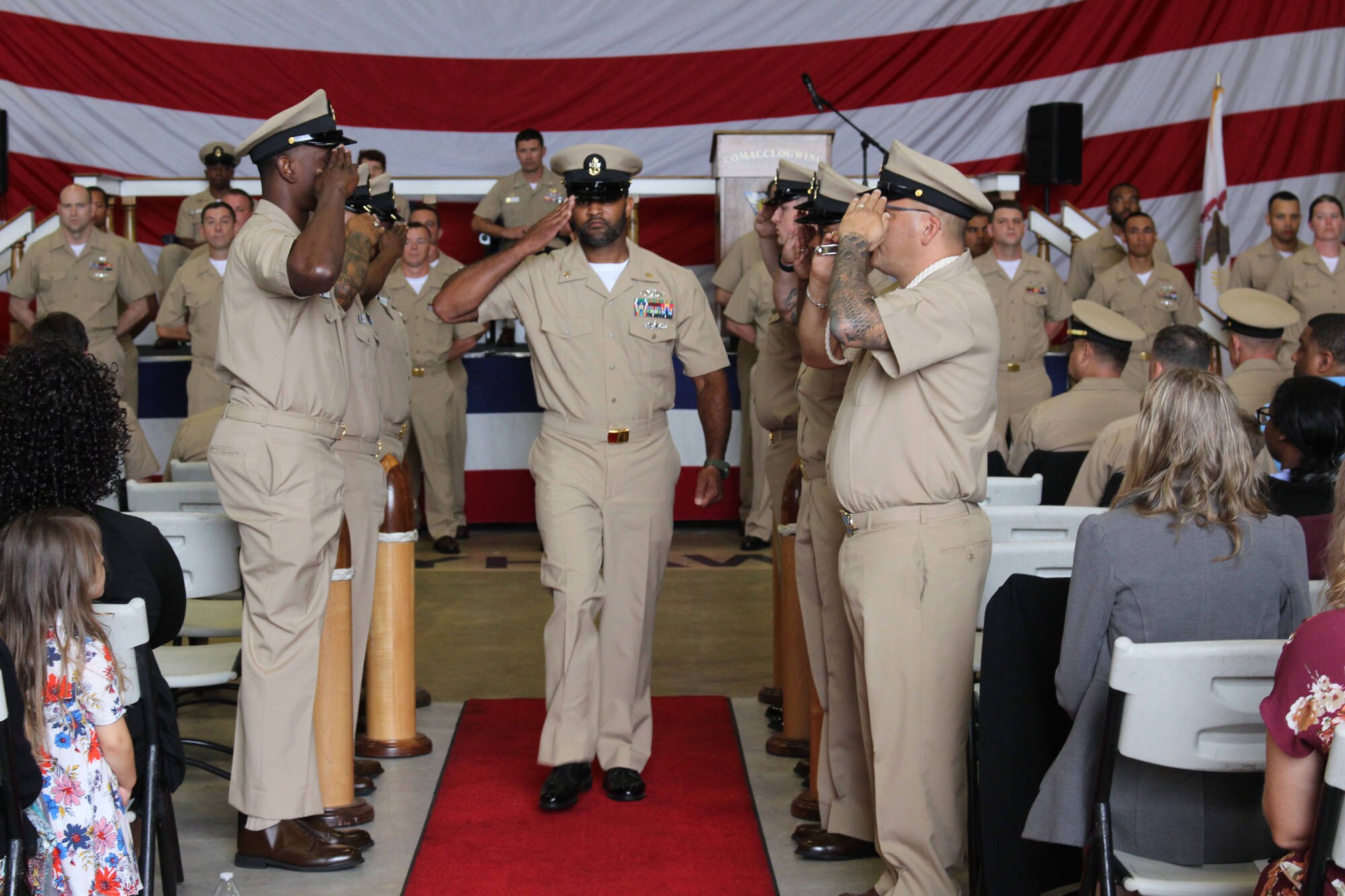 NIWC Atlantic joined forces with the Airborne Command & Control and Logistics Wing (ACCLOGWING) for the 2023 Navy Chief Petty Officer Pinning ceremony hosted by VAW-120 on Sept. 29 at 10:00am in LP-34 Hangar, Norfolk, VA. NIWC Atlantic's YNC Bilaal Porter, ITC Nick Mayer, LSC Matthew Hughes, ITC Jereyme Nova, and OSC Tonya Booker, along with 20 other ACCLOGWING CPO Selectees had their anchors pinned on and their caps donned during the traditional Navy ceremony.  NIWC Atlantic's GySgt Regino Rosales (USMC) also completed the precursor CPO season training and was recognized as an Honorary Navy Chief Petty Officer.