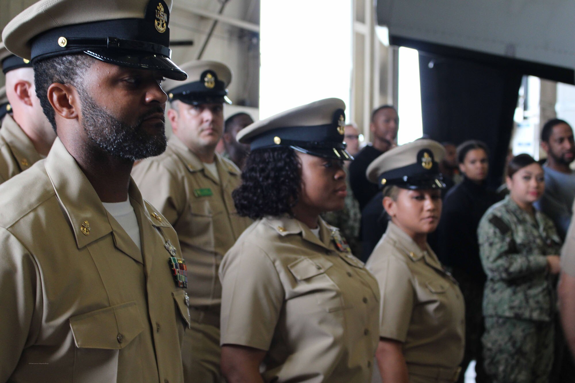 NIWC Atlantic joined forces with the Airborne Command & Control and Logistics Wing (ACCLOGWING) for the 2023 Navy Chief Petty Officer Pinning ceremony hosted by VAW-120 on Sept. 29 at 10:00am in LP-34 Hangar, Norfolk, VA. NIWC Atlantic's YNC Bilaal Porter, ITC Nick Mayer, LSC Matthew Hughes, ITC Jereyme Nova, and OSC Tonya Booker, along with 20 other ACCLOGWING CPO Selectees had their anchors pinned on and their caps donned during the traditional Navy ceremony.  NIWC Atlantic's GySgt Regino Rosales (USMC) also completed the precursor CPO season training and was recognized as an Honorary Navy Chief Petty Officer.