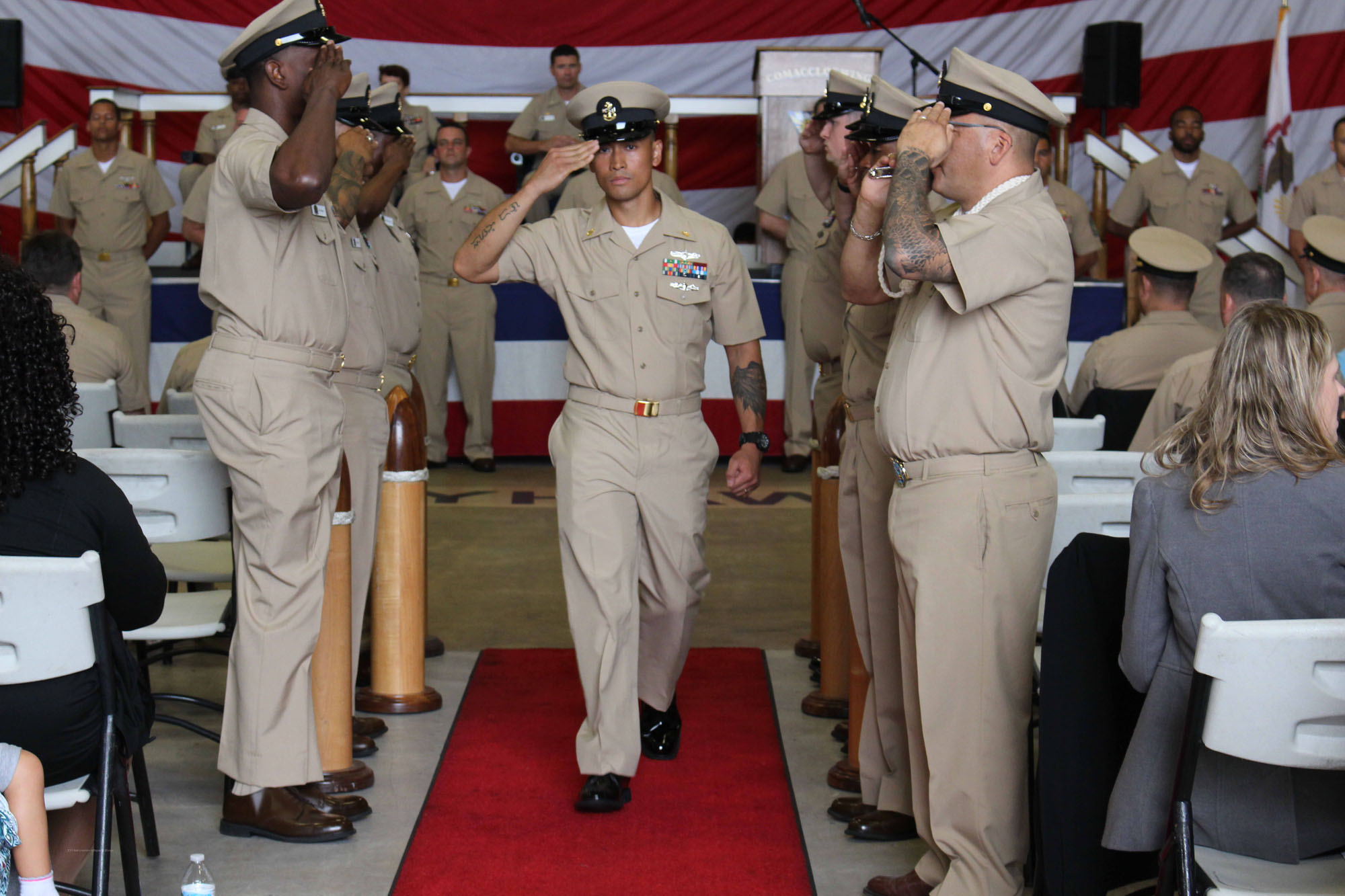 NIWC Atlantic joined forces with the Airborne Command & Control and Logistics Wing (ACCLOGWING) for the 2023 Navy Chief Petty Officer Pinning ceremony hosted by VAW-120 on Sept. 29 at 10:00am in LP-34 Hangar, Norfolk, VA. NIWC Atlantic's YNC Bilaal Porter, ITC Nick Mayer, LSC Matthew Hughes, ITC Jereyme Nova, and OSC Tonya Booker, along with 20 other ACCLOGWING CPO Selectees had their anchors pinned on and their caps donned during the traditional Navy ceremony.  NIWC Atlantic's GySgt Regino Rosales (USMC) also completed the precursor CPO season training and was recognized as an Honorary Navy Chief Petty Officer.