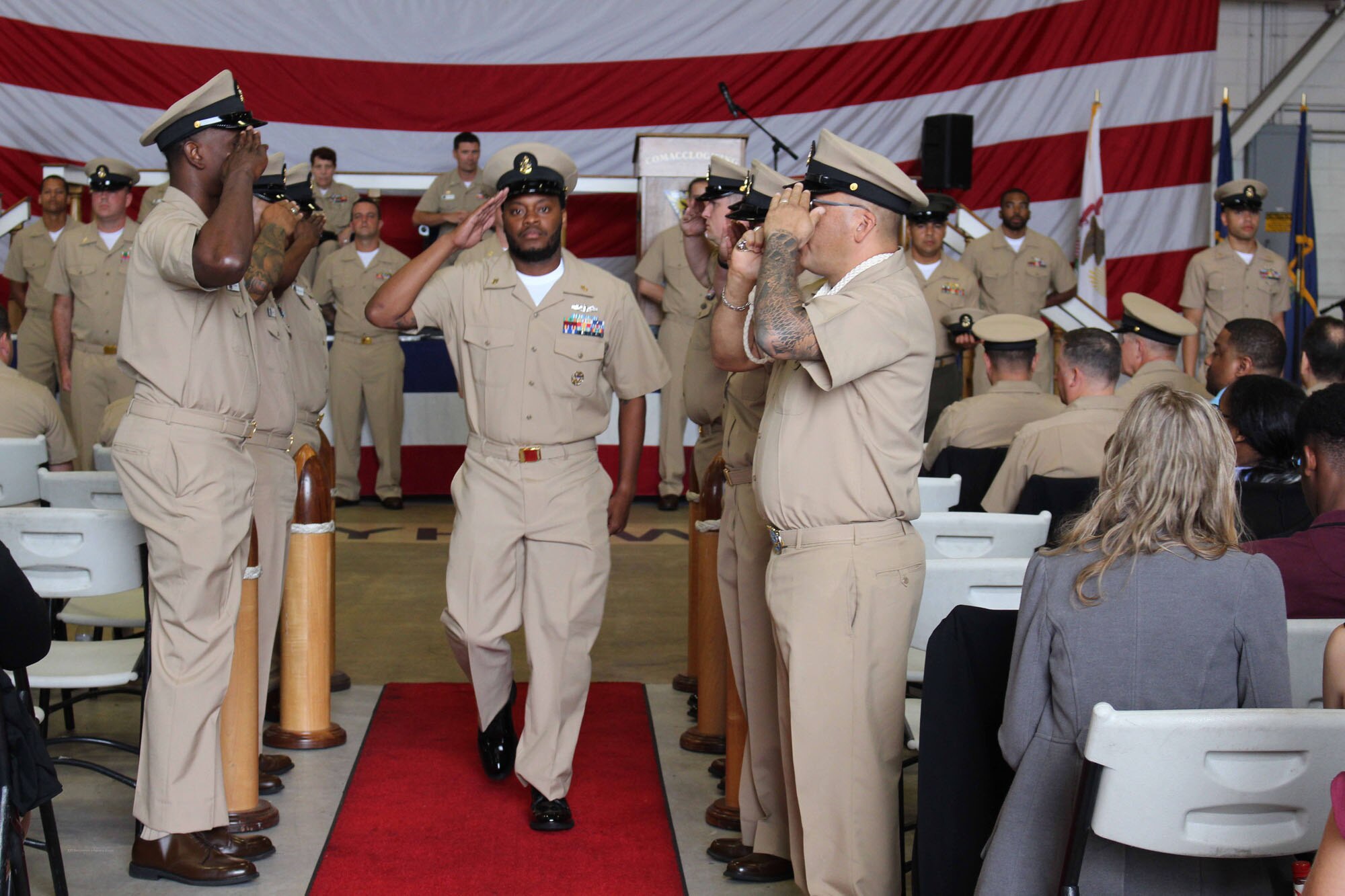 NIWC Atlantic joined forces with the Airborne Command & Control and Logistics Wing (ACCLOGWING) for the 2023 Navy Chief Petty Officer Pinning ceremony hosted by VAW-120 on Sept. 29 at 10:00am in LP-34 Hangar, Norfolk, VA. NIWC Atlantic's YNC Bilaal Porter, ITC Nick Mayer, LSC Matthew Hughes, ITC Jereyme Nova, and OSC Tonya Booker, along with 20 other ACCLOGWING CPO Selectees had their anchors pinned on and their caps donned during the traditional Navy ceremony.  NIWC Atlantic's GySgt Regino Rosales (USMC) also completed the precursor CPO season training and was recognized as an Honorary Navy Chief Petty Officer.