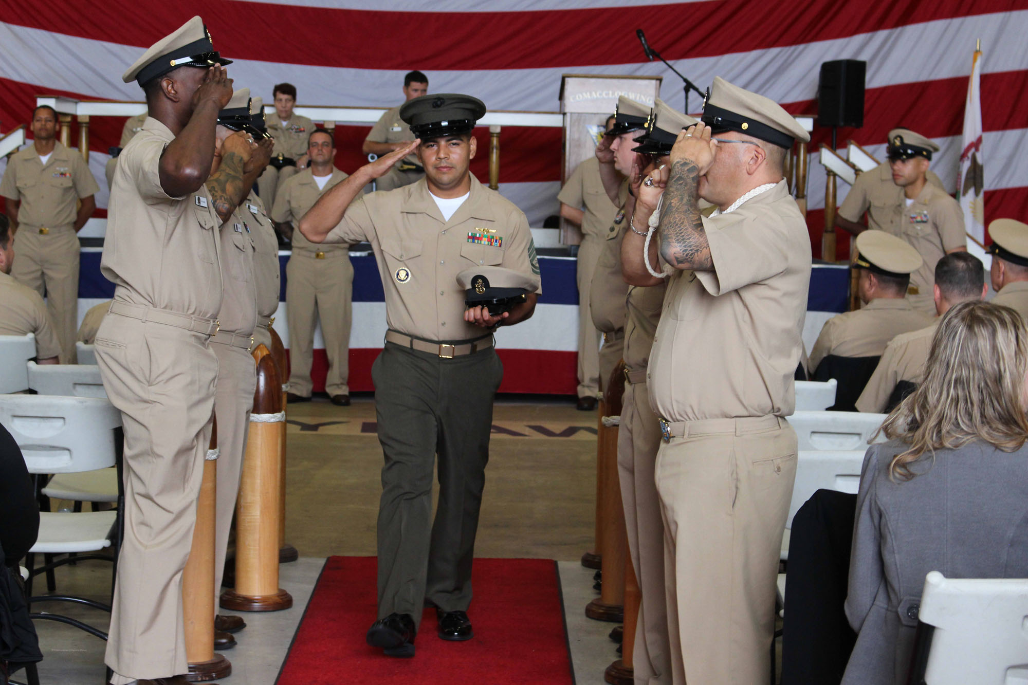 NIWC Atlantic joined forces with the Airborne Command & Control and Logistics Wing (ACCLOGWING) for the 2023 Navy Chief Petty Officer Pinning ceremony hosted by VAW-120 on Sept. 29 at 10:00am in LP-34 Hangar, Norfolk, VA. NIWC Atlantic's YNC Bilaal Porter, ITC Nick Mayer, LSC Matthew Hughes, ITC Jereyme Nova, and OSC Tonya Booker, along with 20 other ACCLOGWING CPO Selectees had their anchors pinned on and their caps donned during the traditional Navy ceremony.  NIWC Atlantic's GySgt Regino Rosales (USMC) also completed the precursor CPO season training and was recognized as an Honorary Navy Chief Petty Officer.