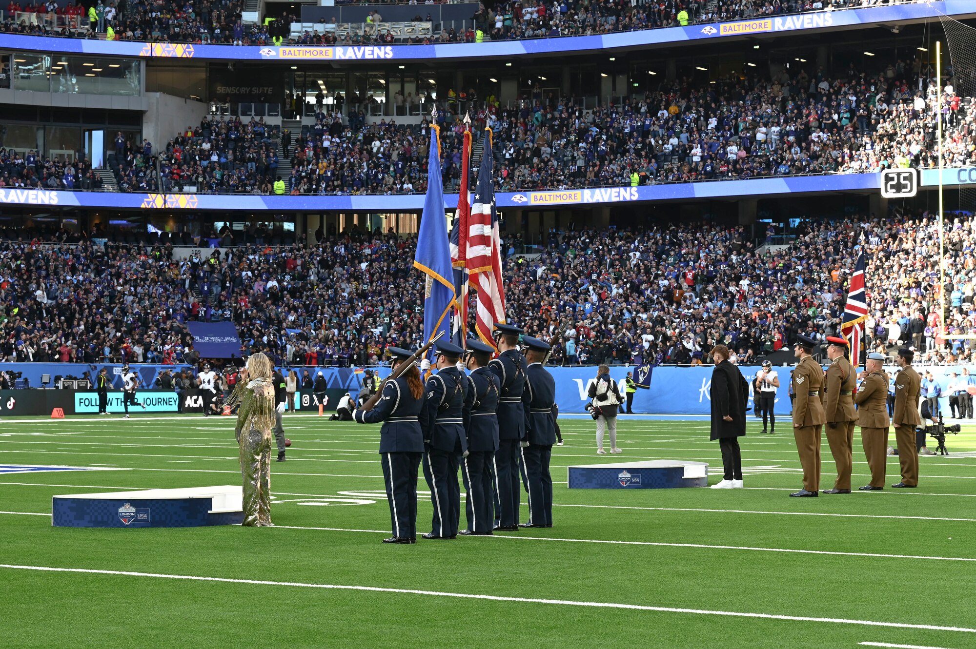The pre-game ceremony featured more than 40 Airmen unfurling the flag along with the RAF Lakenheath Honor Guard.