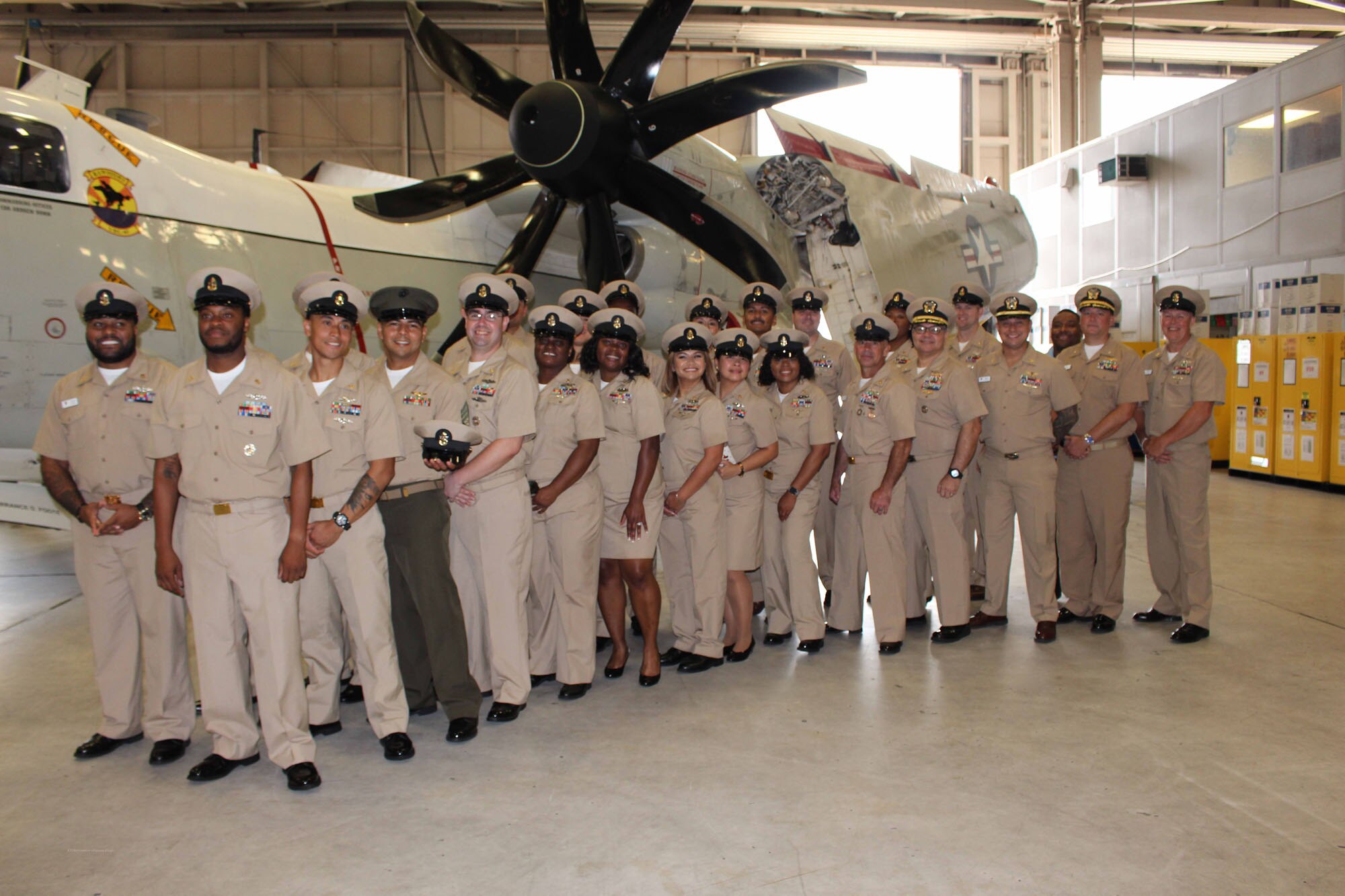 NIWC Atlantic joined forces with the Airborne Command & Control and Logistics Wing (ACCLOGWING) for the 2023 Navy Chief Petty Officer Pinning ceremony hosted by VAW-120 on Sept. 29 at 10:00am in LP-34 Hangar, Norfolk, VA. NIWC Atlantic's YNC Bilaal Porter, ITC Nick Mayer, LSC Matthew Hughes, ITC Jereyme Nova, and OSC Tonya Booker, along with 20 other ACCLOGWING CPO Selectees had their anchors pinned on and their caps donned during the traditional Navy ceremony.  NIWC Atlantic's GySgt Regino Rosales (USMC) also completed the precursor CPO season training and was recognized as an Honorary Navy Chief Petty Officer.