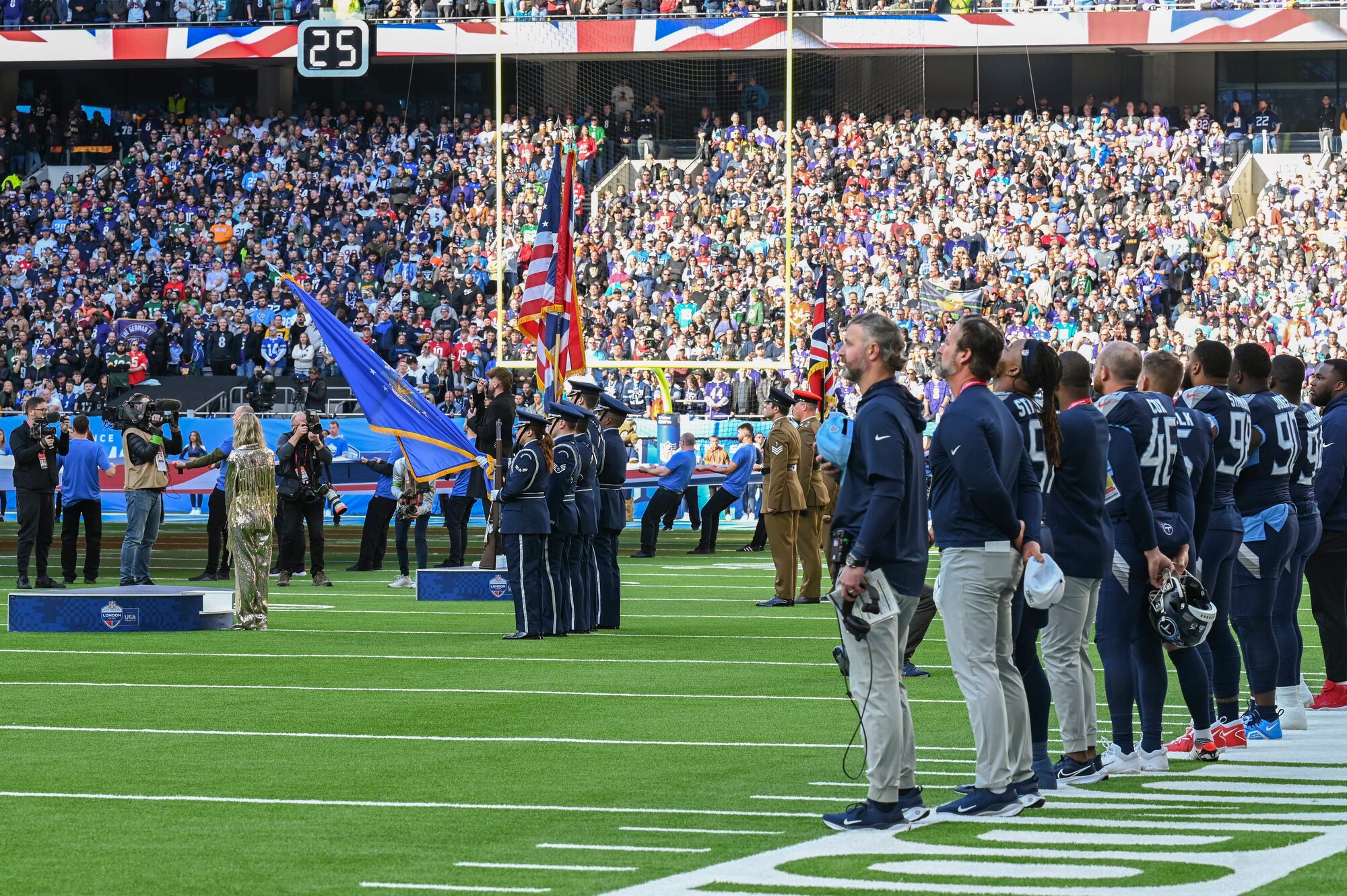 The pre-game ceremony featured more than 40 Royal Air Force Mildenhall Airmen unfurling the flag along with the RAF Lakenheath Honor Guard.
