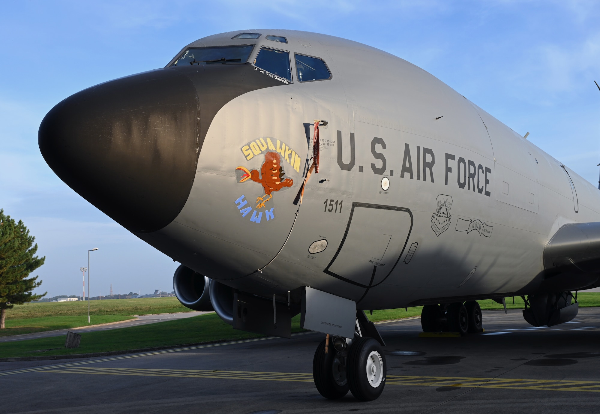 One of the two newest additions to the 100th Air Refueling Wing’s KC-135 Stratotankers bearing its heritage nose art, “Squawkin Hawk,” is displayed for all to see after being unveiled during a nose art dedication ceremony at Royal Air Force Mildenhall, England, Oct. 10, 2023. Family members of two of the original crew members from the World War II B-17 Flying Fortress of the same name, attended the ceremony and shared memories and stories about their 100th Bomb Group connections. (U.S. Air Force photo by Karen Abeyasekere)