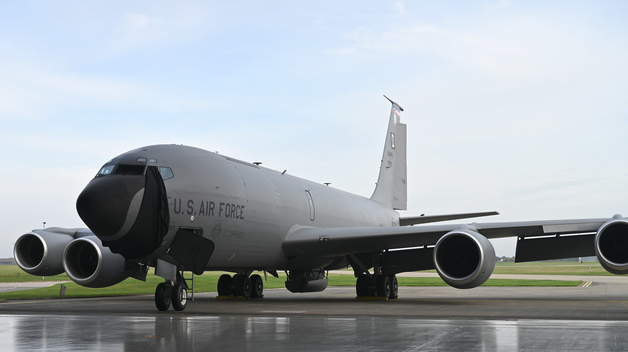 A U.S. Air Force KC-135 Stratotanker, from the 100th Air Refueling Wing, stands ready to have its new heritage nose art – “Squawkin Hawk” – unveiled at a dedication ceremony at Royal Air Force Mildenhall, England, Oct. 10, 2023. The ceremony was held on the 80th anniversary of the infamous Munster, Germany, mission of Oct. 10, 1943, when the 100th Bomb Group suffered its greatest loss of aircraft and crew; 12 aircraft and 121 crew perished in the skies over Germany, and it earned its infamous moniker, the “Bloody Hundredth.” (U.S. Air Force photo by Karen Abeyasekere)