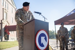Lt. Col. Matthew Sprecher, operations chaplain, 1st Theater Sustainment Command, offers an invocation.