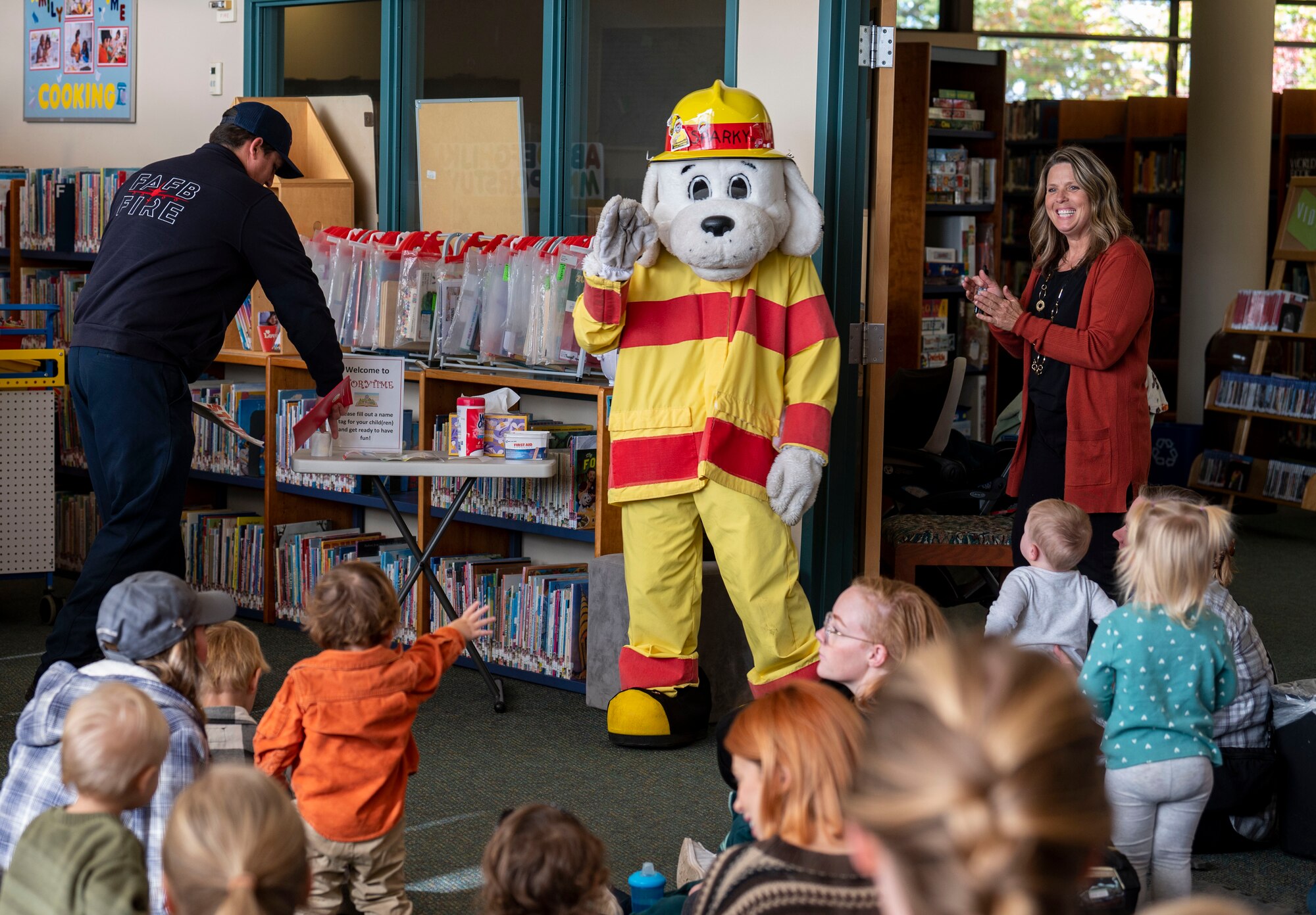 Sparky the Fire Dog, the mascot for the National Fire Protection Association, greets children.