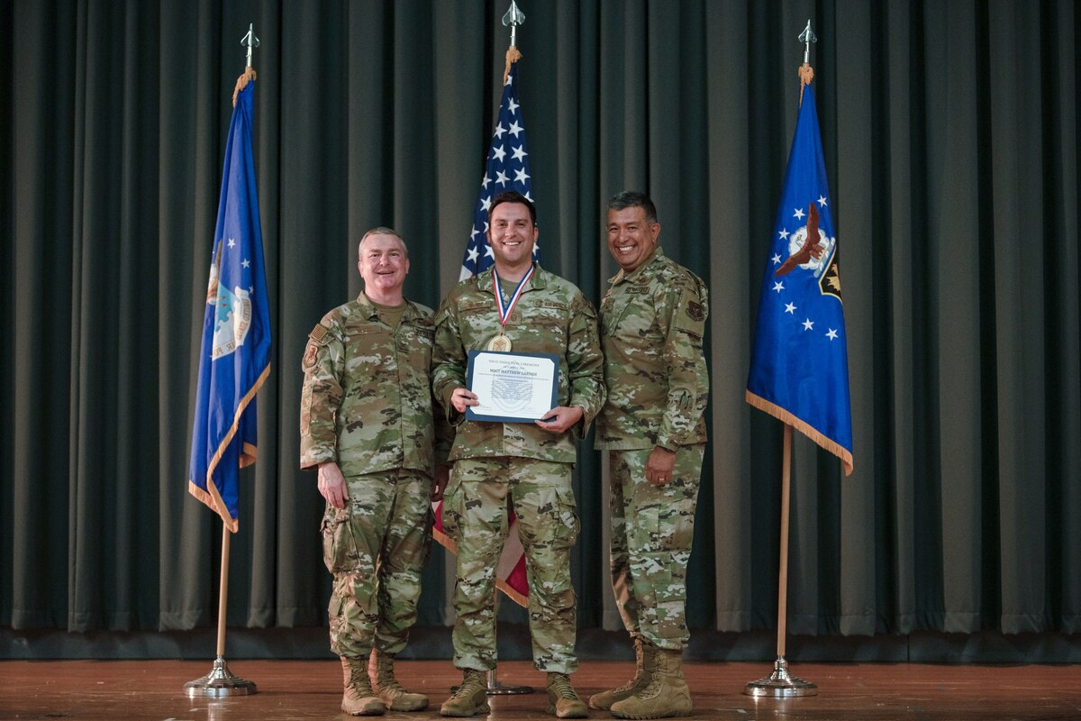 Members of the 349th Air Mobility Wing gathered to celebrate the achievement of it's members who recently achieved the rank of Non-Commissioned Officer or Senior Non-Commissioned Officer.