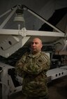 Air Force Master Sgt. Ryan Colon, pictured here as a technical sergeant with the Florida Air National Guard’s 114th Electromagnetic Warfare Squadron, poses in front of space-based equipment at Patrick Air Force Base, Florida, June 29, 2022. Colon is the first enlisted Airman in the Air National Guard to graduate from the Space Warfighter Advanced Instructor Course at the U.S. Air Force Weapons School in Nellis Air Force Base, Nevada.