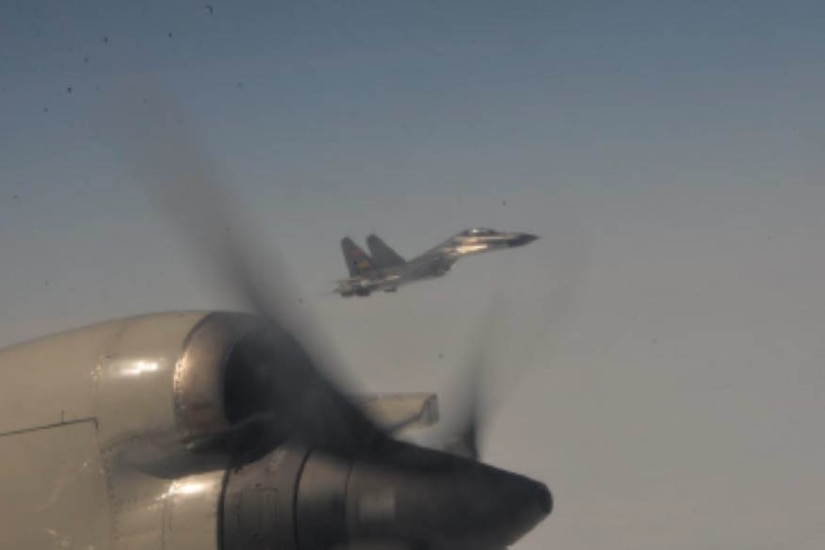 A fighter jet is seen from another aircraft.