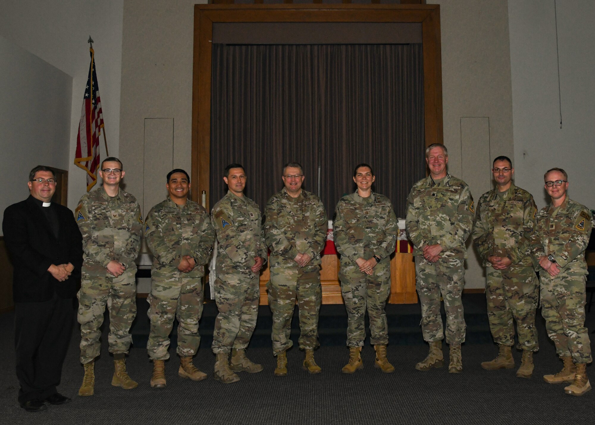 U.S. Air Force Maj. Gen. Randall Kitchens, Department of the Air Force chief of chaplains (center left), and Air Force Command Chief Master Sgt. Sadie Chambers, DAF Religious Affairs senior enlisted leader (center right), pose for a photo with the Space Launch Delta 30 Chapel leadership at Vandenberg Space Force Base, Calif., Sept. 20, 2023.