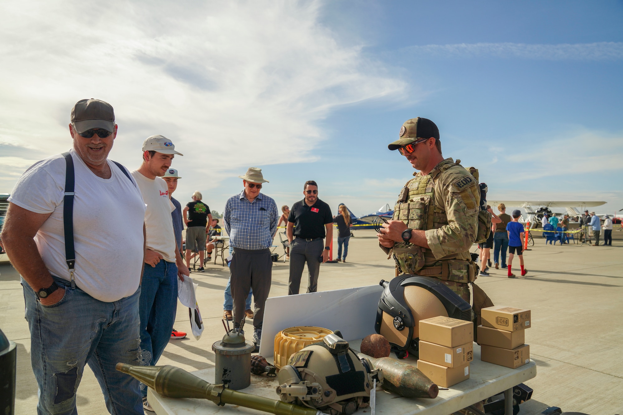 U.S. Air Force Staff Sgt. Connor Ely, Explosive Ordnance Disposal (EOD) technician, 9th Civil Engineer Squadron, answers questions of community members at the Chico Regional Airport Open House Chico, California on Oct. 14, 2023.