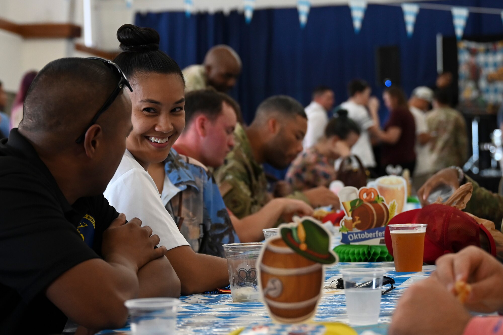 U.S. service members and their families socialize during the 36th Wing First Friday Oktoberfest event at Andersen Air Force Base, Guam, Oct. 6, 2023.