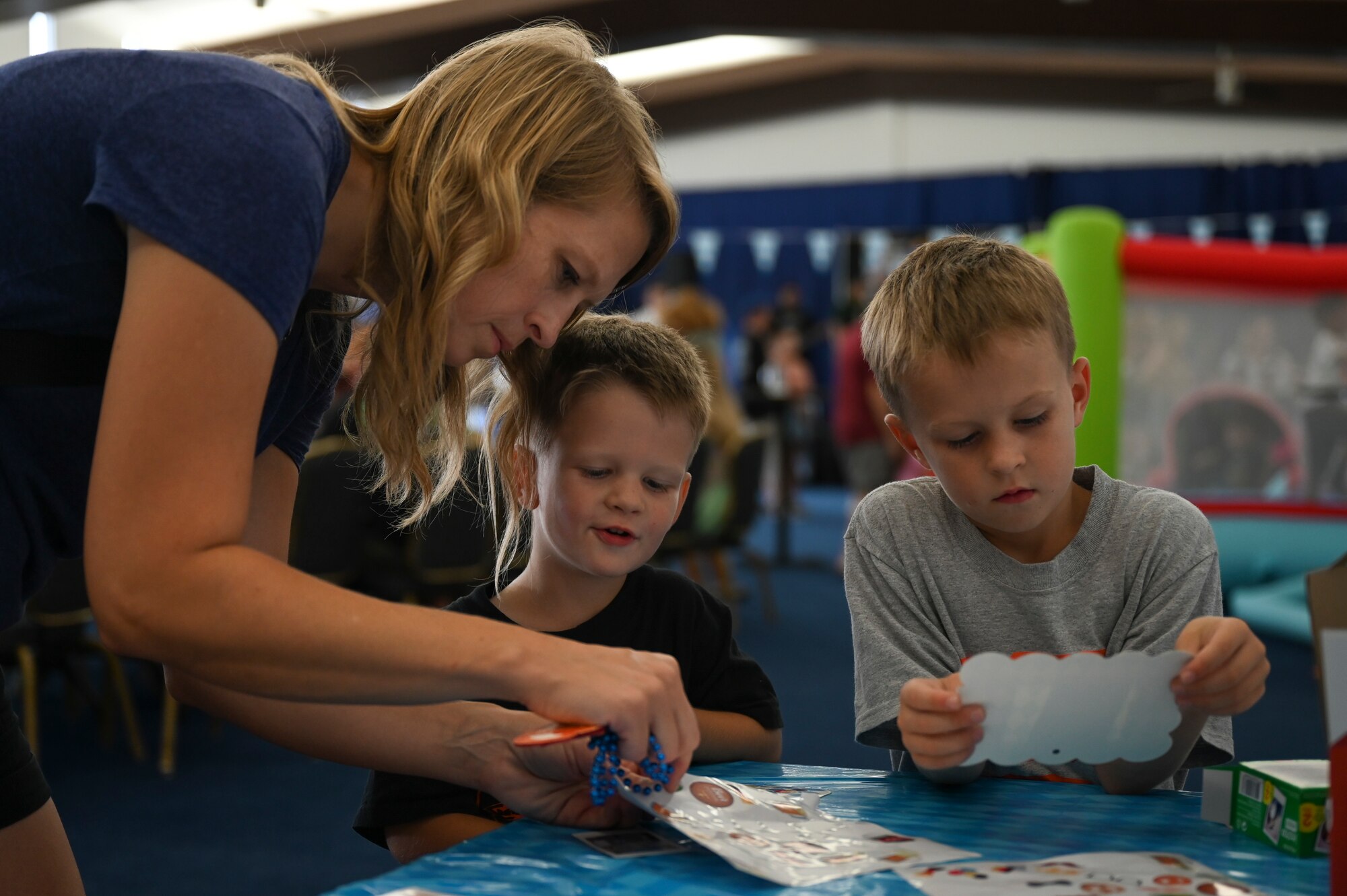A military family decorates their photos during the 36th Wing First Friday Oktoberfest event at Andersen Air Force Base, Guam, Oct. 6, 2023.