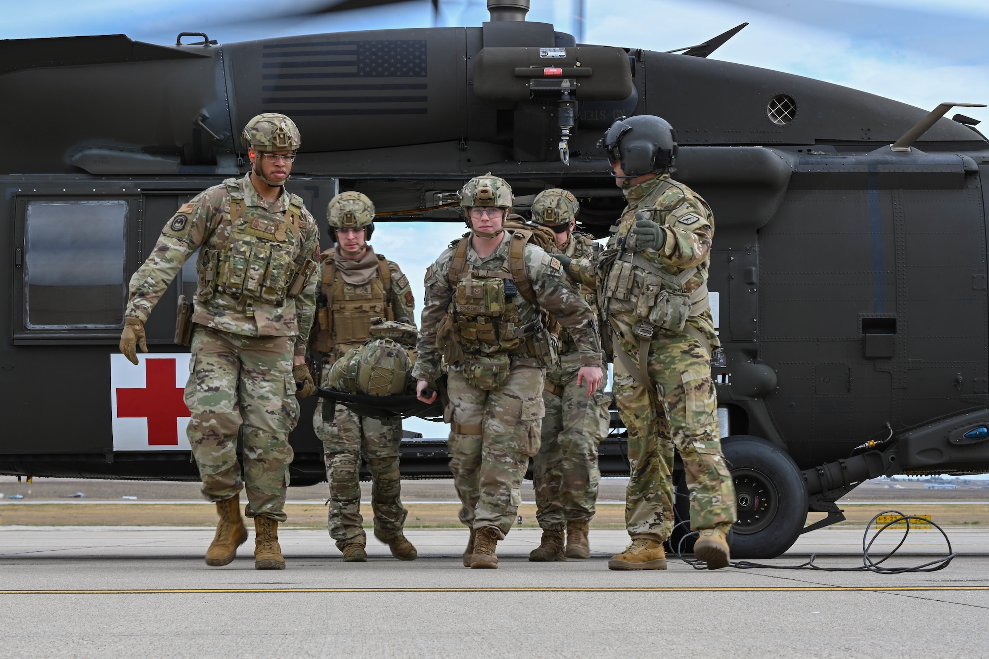 Ellsworth Airmen train with Local Army National Guard on helicopter medical evacuation procedures