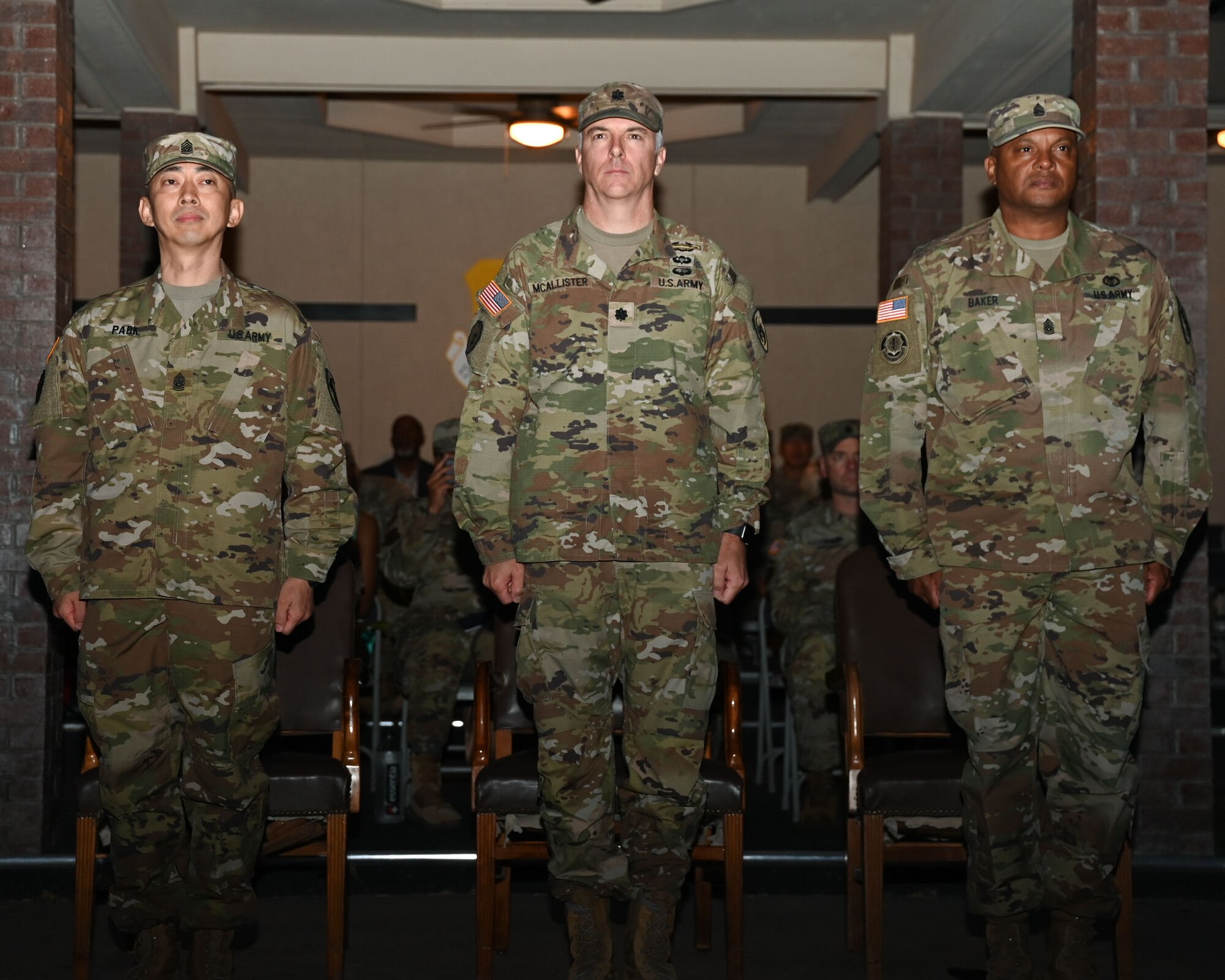 U.S. Army Command Sgt. Maj. TaeSung Park, left, incoming 344th Military Intelligence Battalion command sergeant major, Lt. Col John McAllister, middle, 344th MI BN commander and Sgt. Maj. Sudan Baker, right, outgoing 344th MI BN command sergeant major, stand in front of the battalion after the passing of the guidon during the 344th MI BN assumption of responsibility ceremony at the parade field, Goodfellow Air Force Base, Texas, Oct. 11, 2023. After serving as command sergeant major for two years, Baker transferred responsibility to Park as the 344th MI BN command sergeant major. (U.S. Air Force photo by Airman 1st Class Evelyn J. D’Errico)