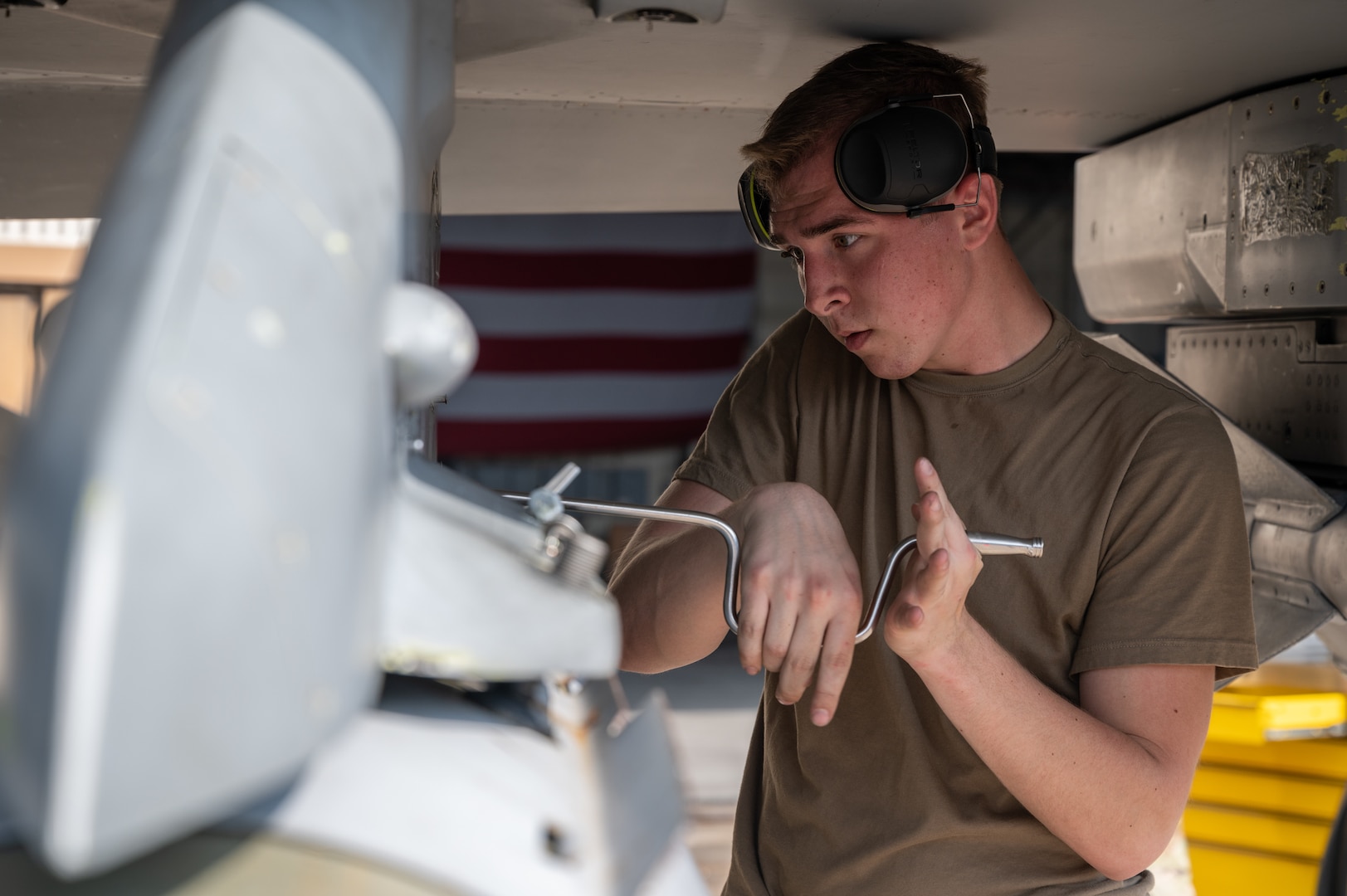 A load crew member, secures a munition during Pen Fest, the annual bilateral munitions load crew competition at Kunsan Air Base