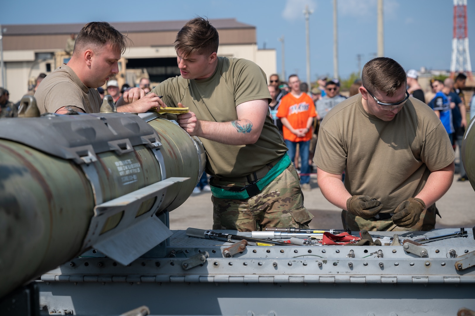 8th Maintenance Squadron munitions systems specialists, prepare munitions during Pen Fest, the annual bilateral munitions load crew competition at Kunsan Air Base