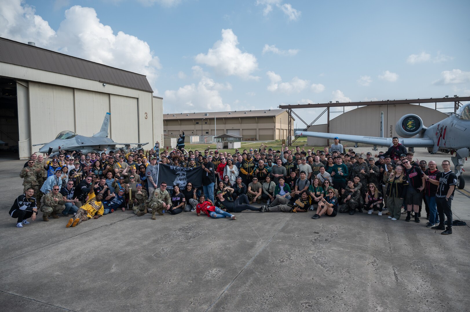 Competitors and spectators from Osan Air Base, Kunsan, AB and Republic of Korea 38th Fighter Group gather for a group photo after the conclusion of Pen Fest, the annual bilateral munitions load crew competition at Kunsan AB