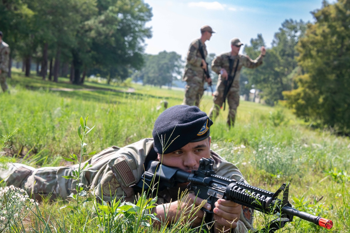 Airman 1st Class Michael Howerton (front) securing the area with the support of Tech. Sgt. Robert Tatum and 2nd Lt. Tristen Phelps (back) during improvised explosive device training
