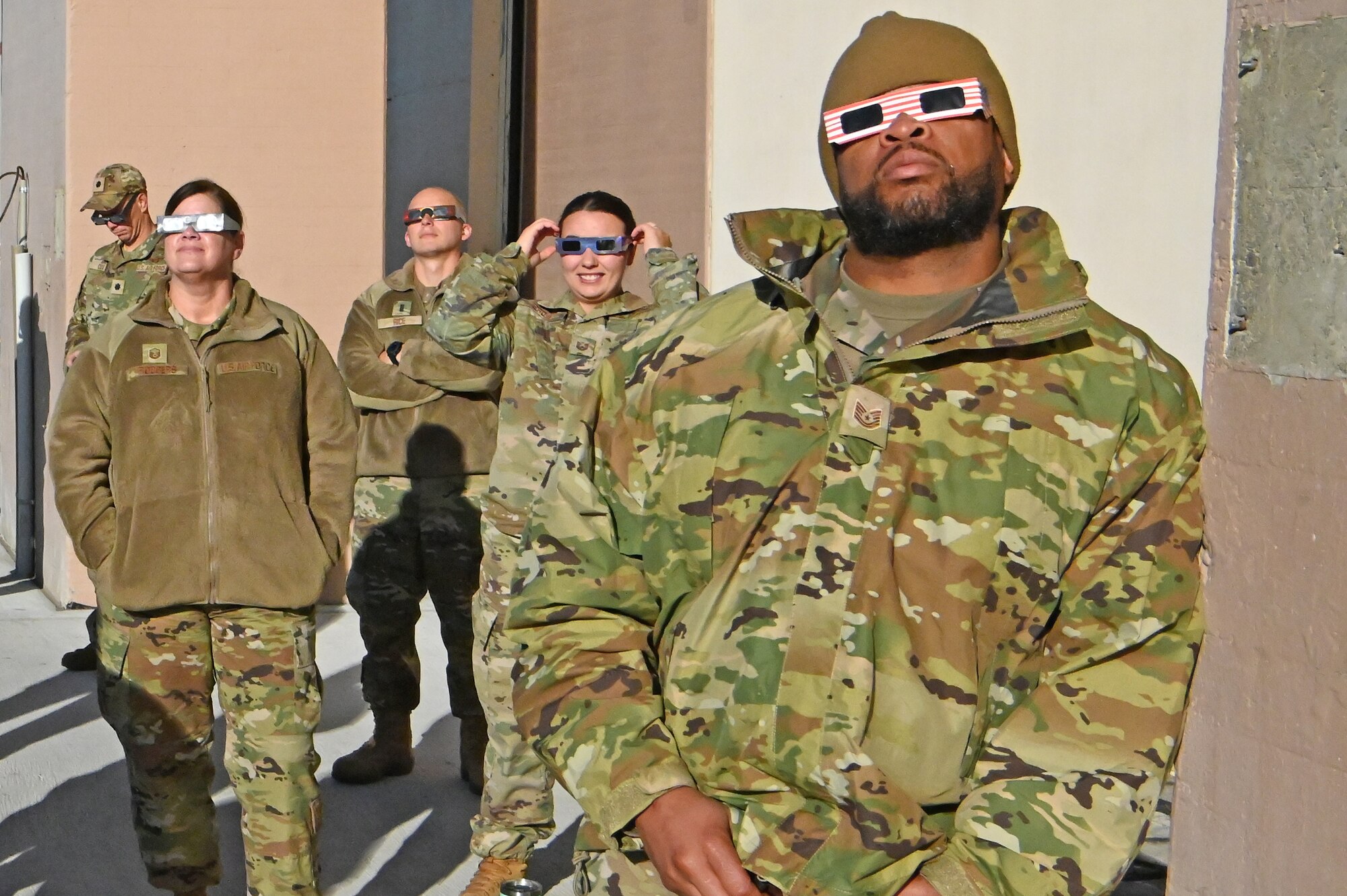 A group of 173rd Fighter Wing Airmen take the opportunity to view the solar eclipse during drill weekend.
