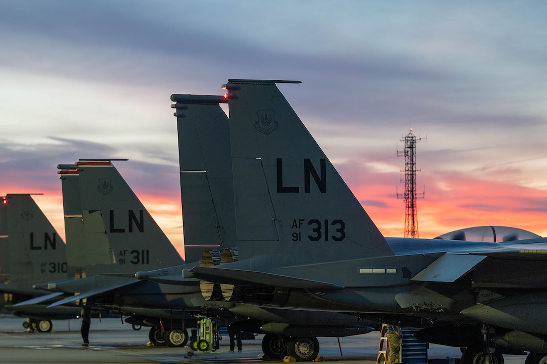 F-15E Strike Eagles sit on the flightline prior to departure for a deployment.