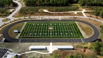 A New Hampshire Army National Guard Black Hawk helicopter flyby provided an aerial view of the Guard's new athletic field at the Edward Cross Training Complex on Oct. 17, 2023, in Pembroke, New Hampshire.  The field, which was recently resurfaced with artificial turf, will facilitate various military and community athletic events.