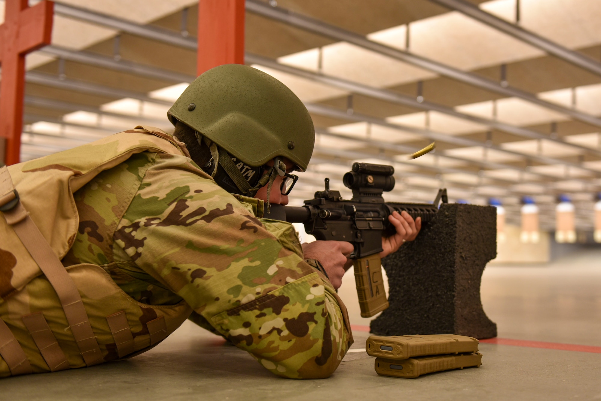 An Airman shoots an M4 Carbine rifle during a Combat Arms Training and Maintenance course.