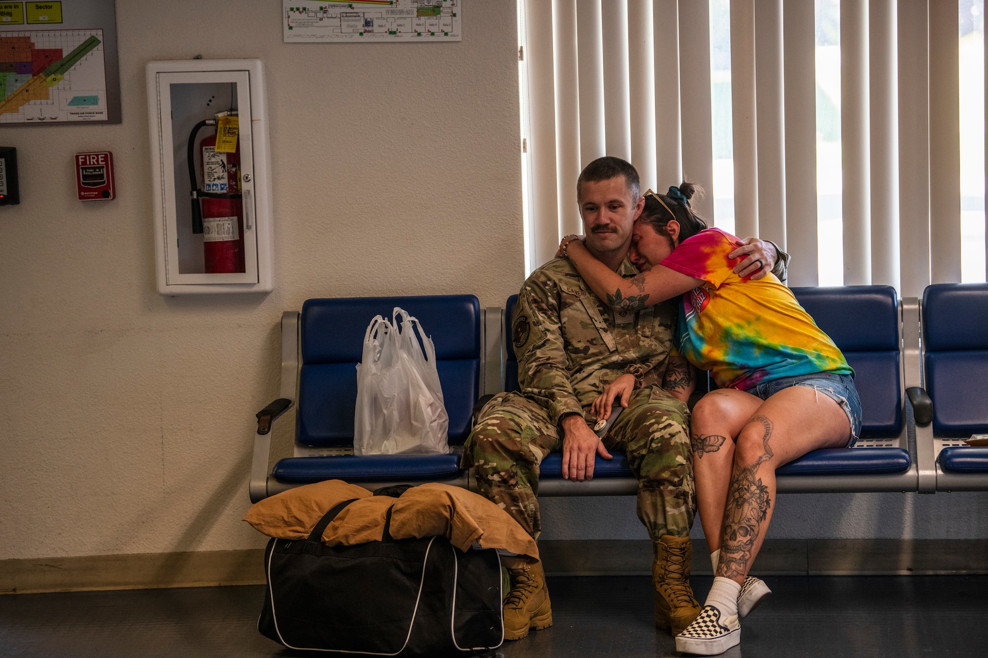 family member crying with a military personnel