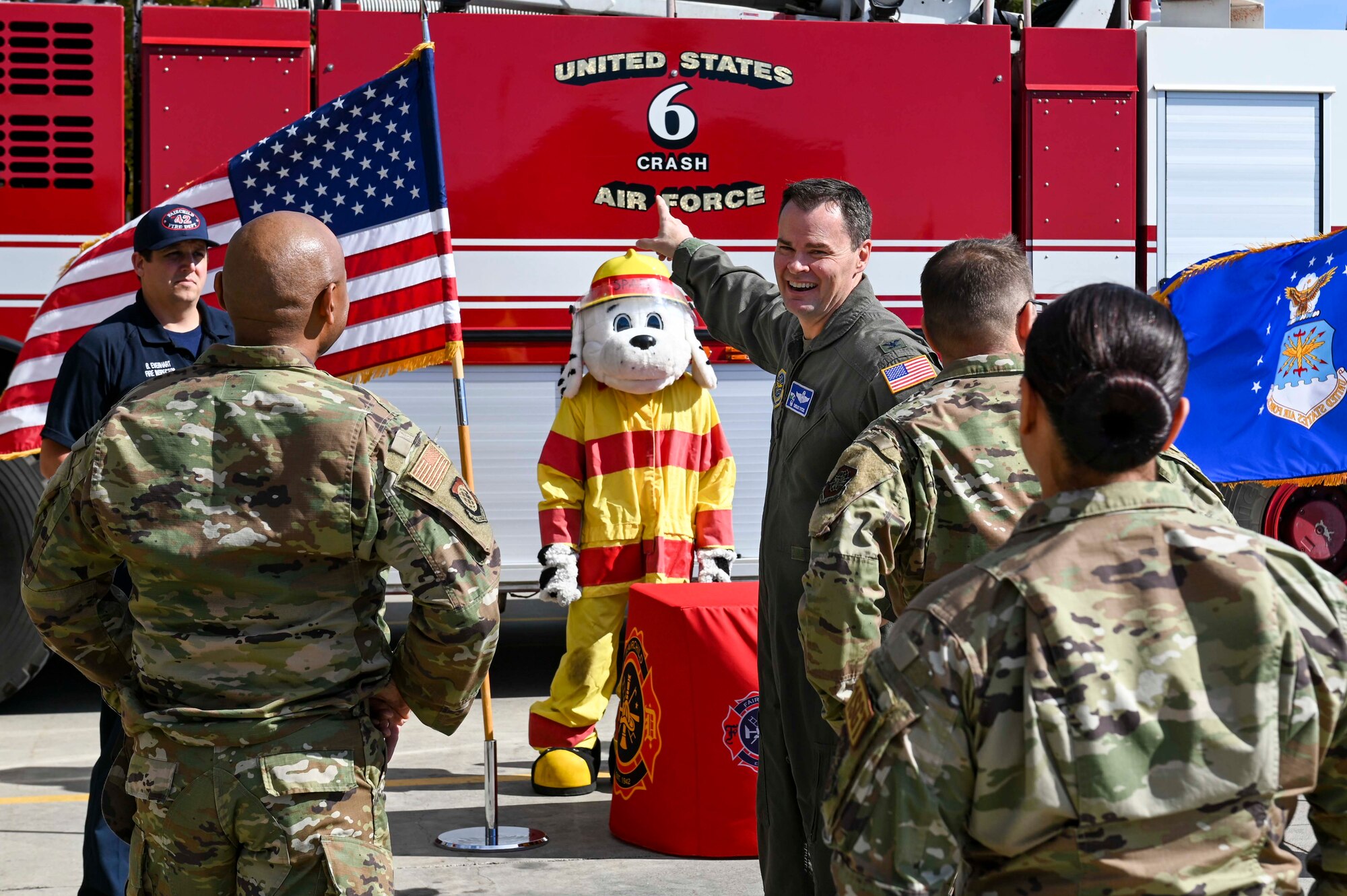 Col. Dycus points to a fire truck