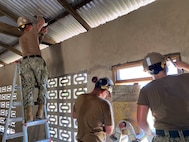 NMCB-133 building maintenance at a local school in Nutekpor, Ghana.