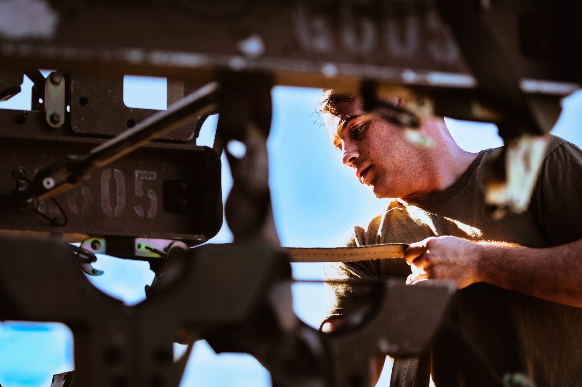 U.S. Air Force Senior Airman Jacob Schweigart, 309th Aircraft Maintenance Unit weapons load crew member, helps prepare a GBU-12 Paveway II bomb for a U.S. Air Force F-35A Lightning II during the third quarterly weapons load competition.
